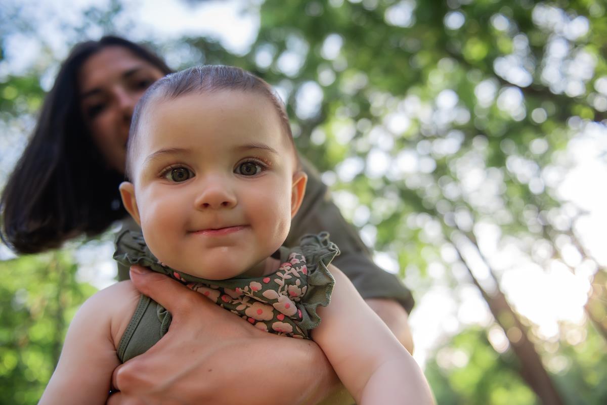 baby posing with mother