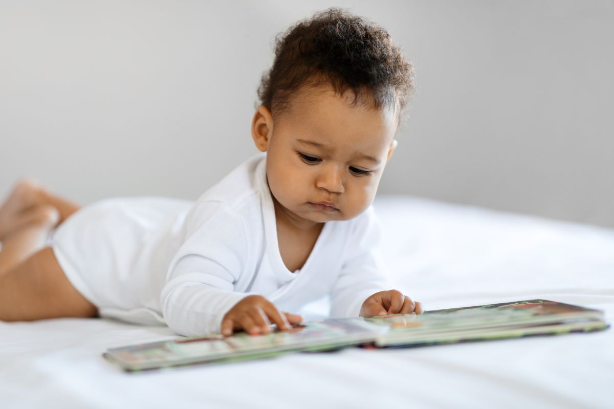 baby is reading book