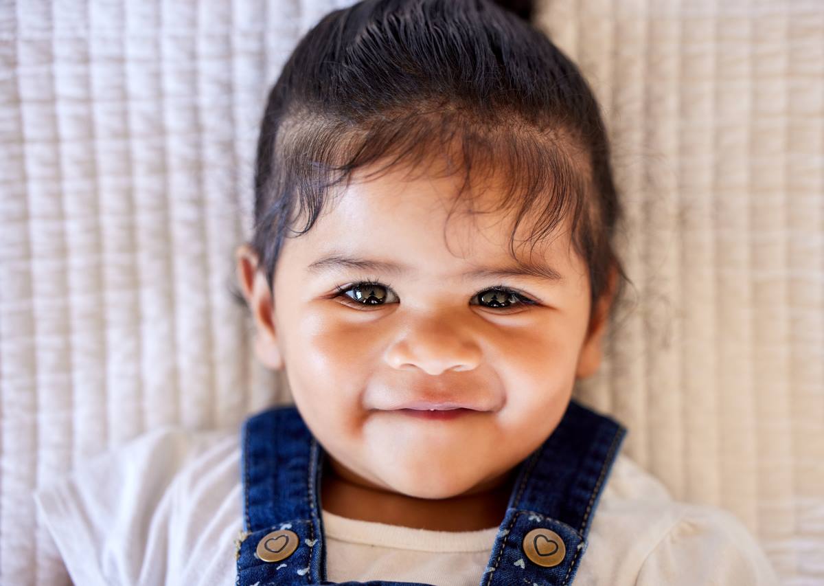 baby smiling at camera