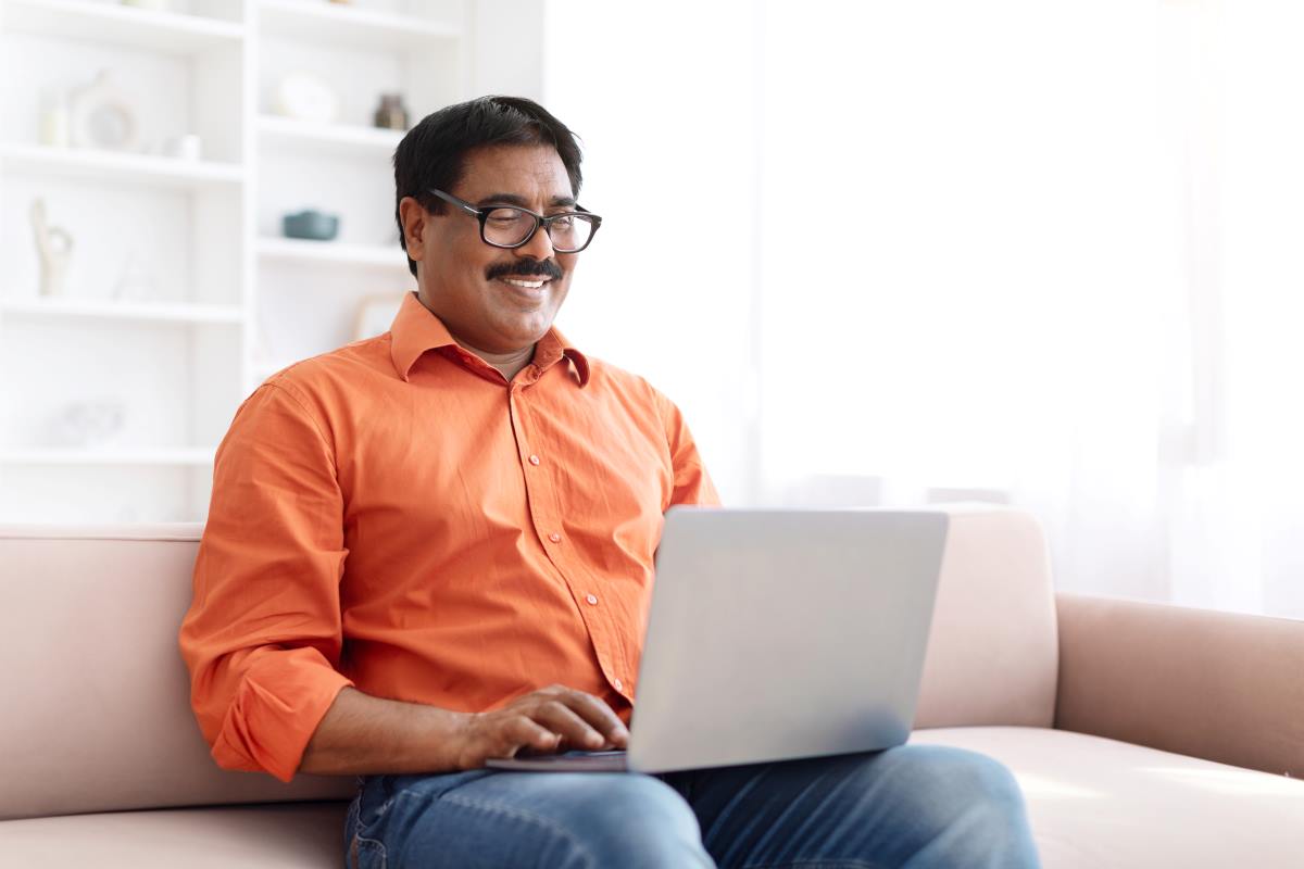 indian man using laptop