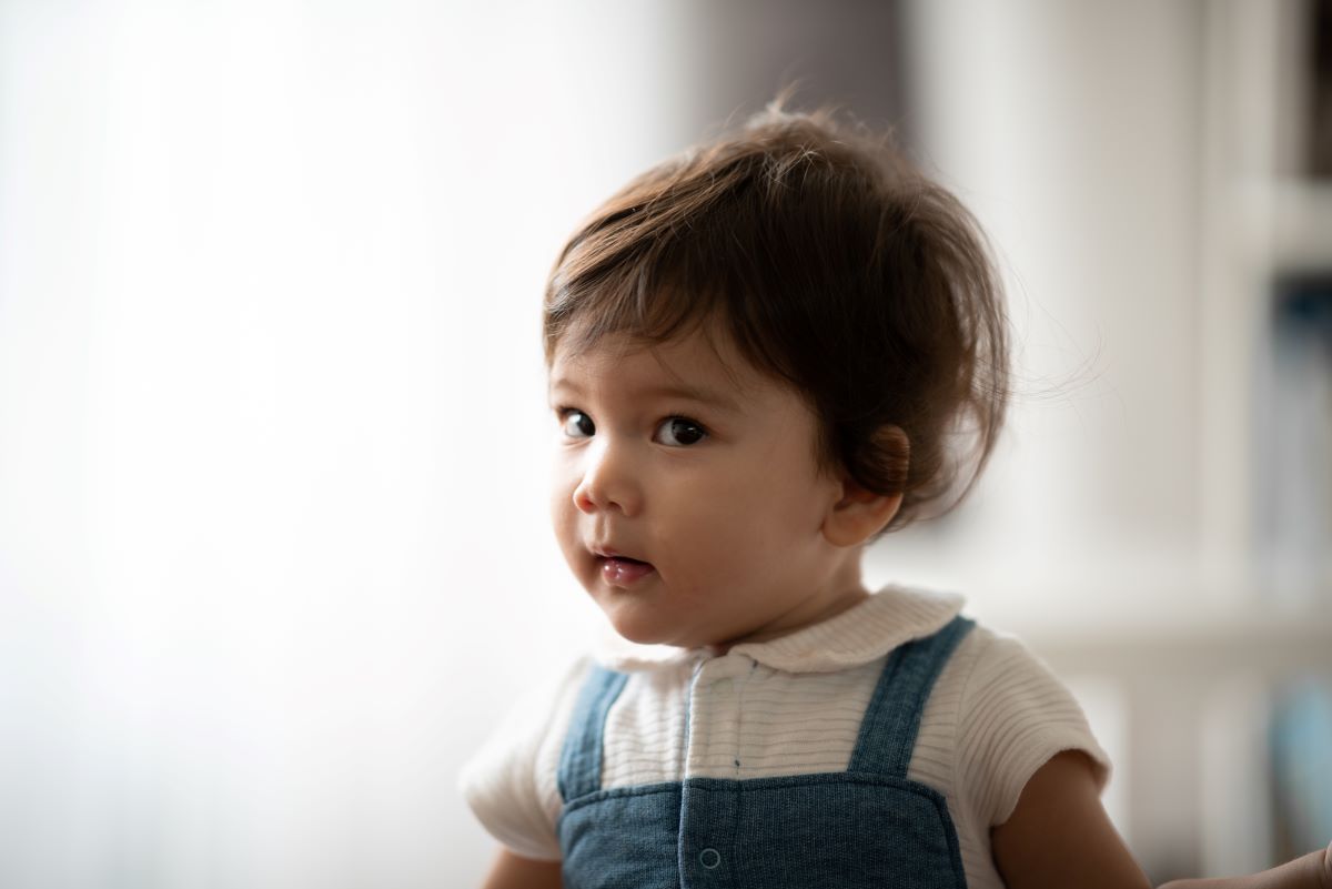 toddler sitting and posing for camera