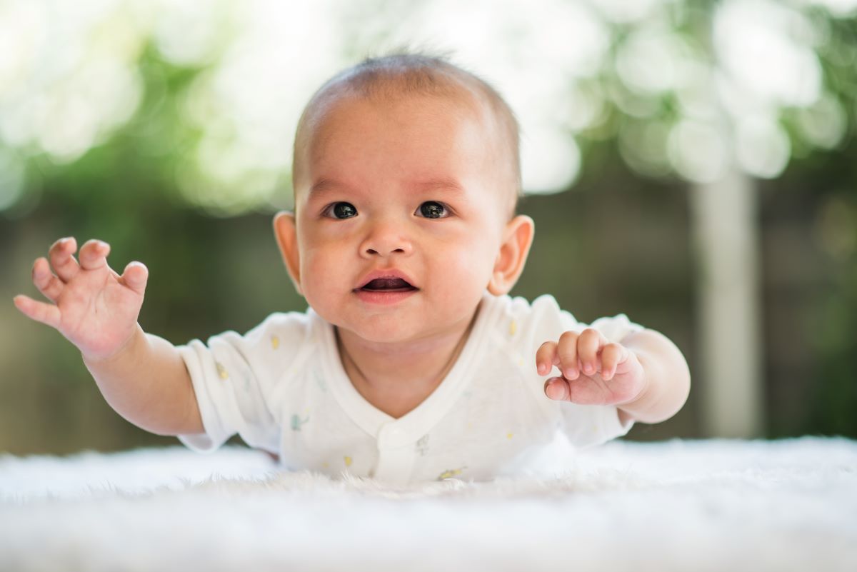 baby relaxing on rug