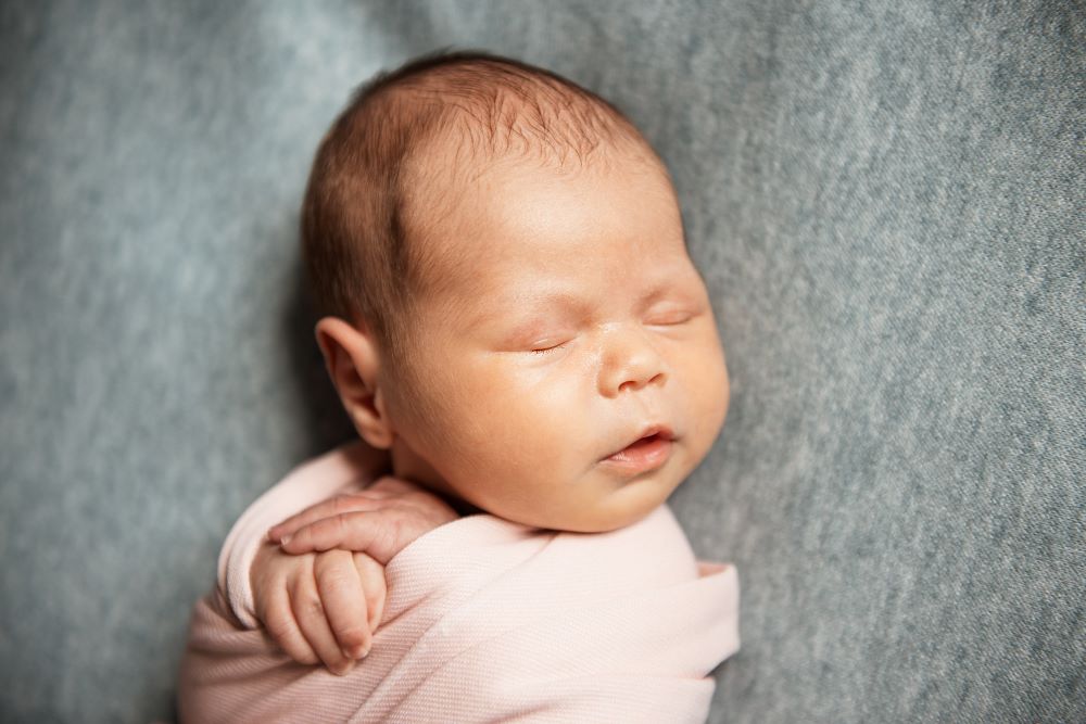 sleeping newborn baby girl