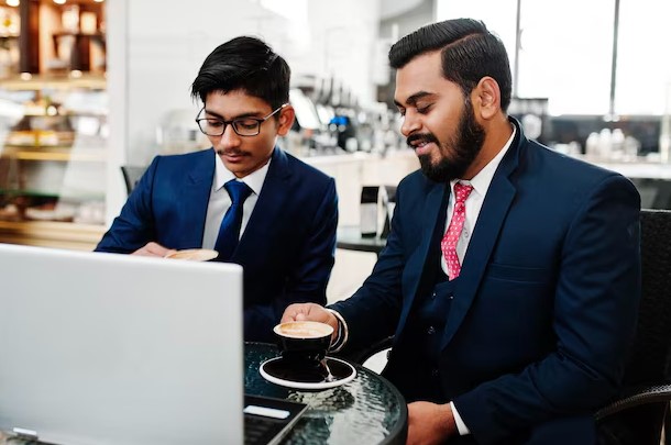 two indian business men running business